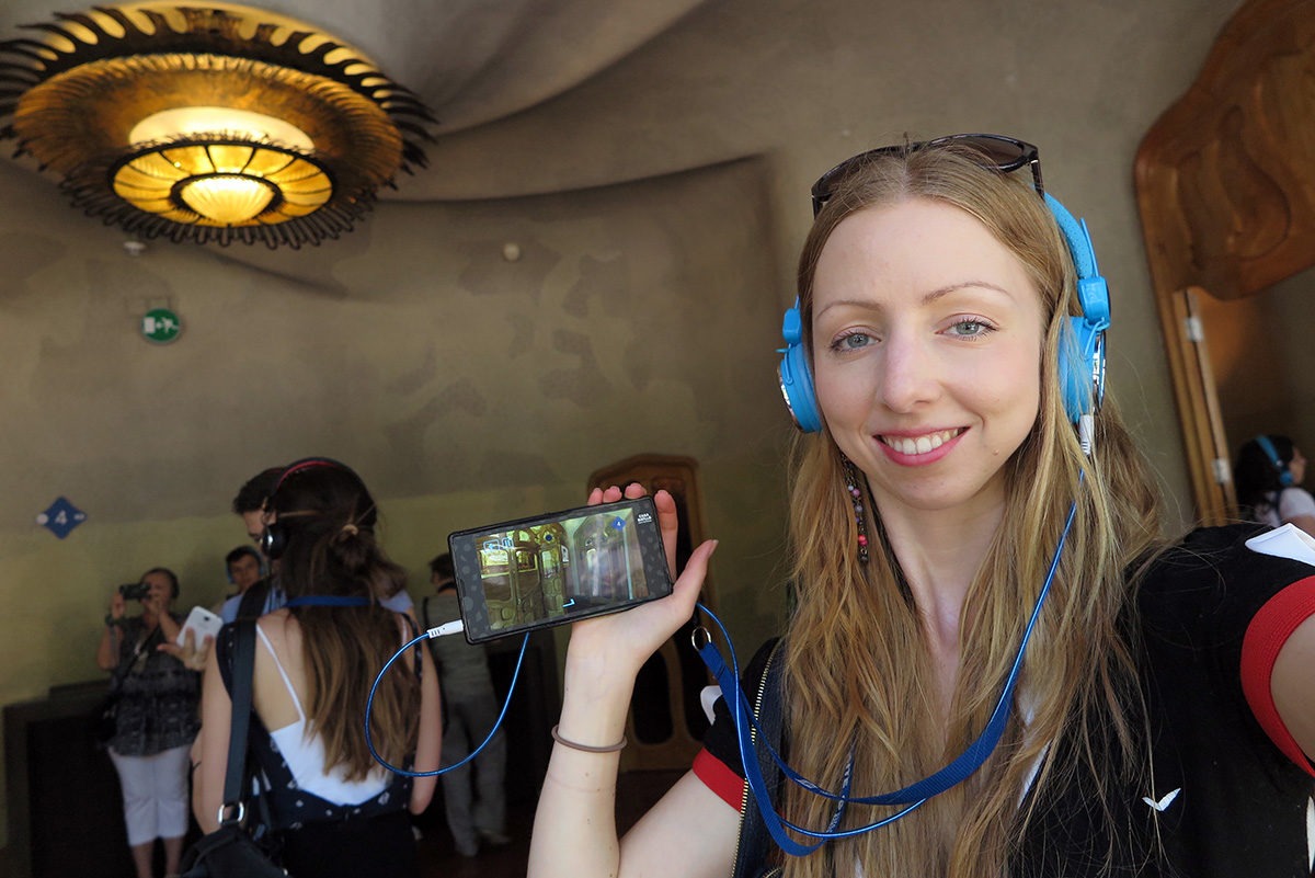 Using a video guide in Casa Batllo, Barcelona