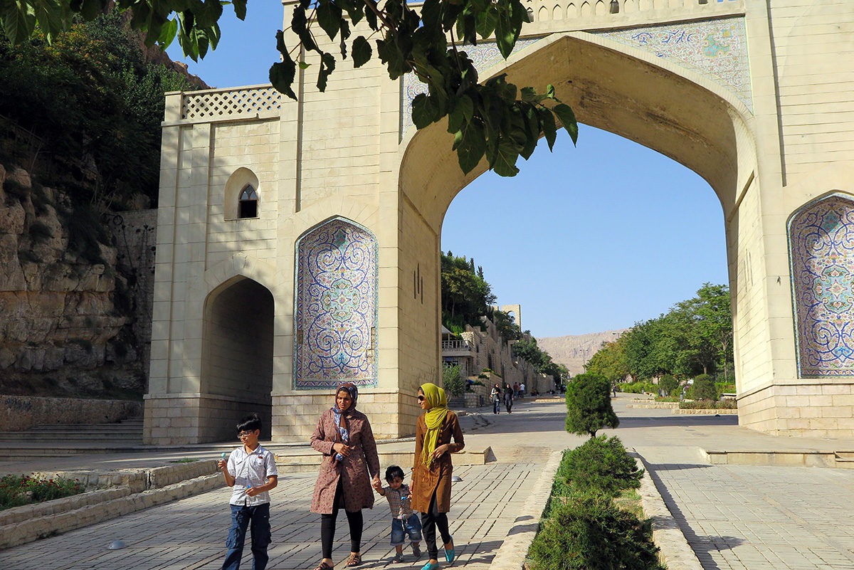 Women with kids in front of Quran Gate, Shiraz, Iran