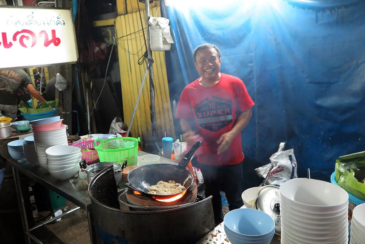 This guy is a hero, making around 300 noodle dishes a day - all on fire in a dirty little backstreet. - street food in Bangkok