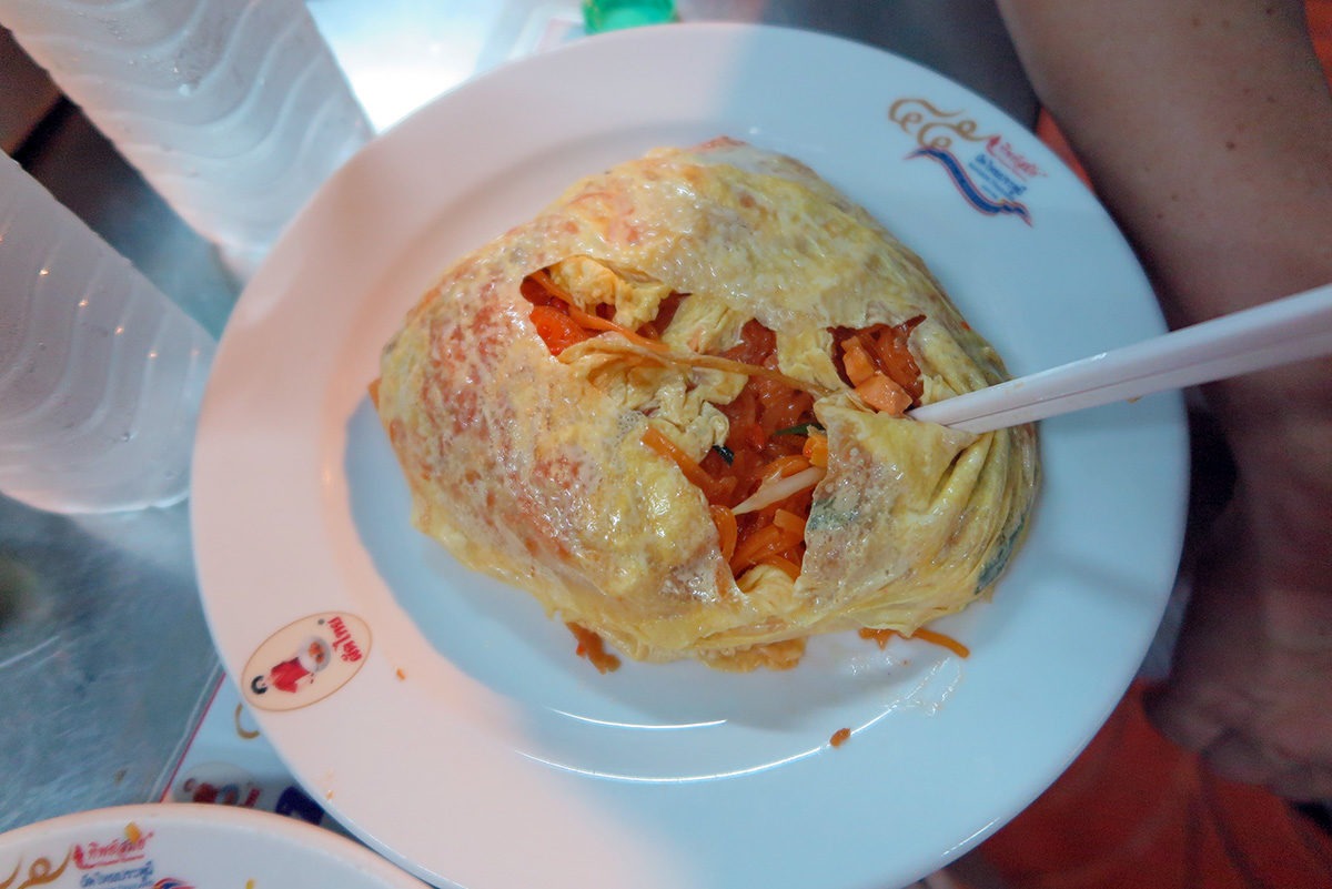 I didn't love absolutely everything I got on a plate.. like this version of Pad Thai - coated with egg layer, which you need to tear to eat it... - street food in Bangkok