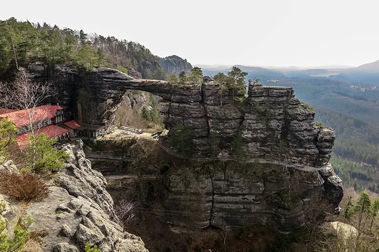 Pravčická Gate with the red roof of Falcon's Nest, Bohemian Switzerland