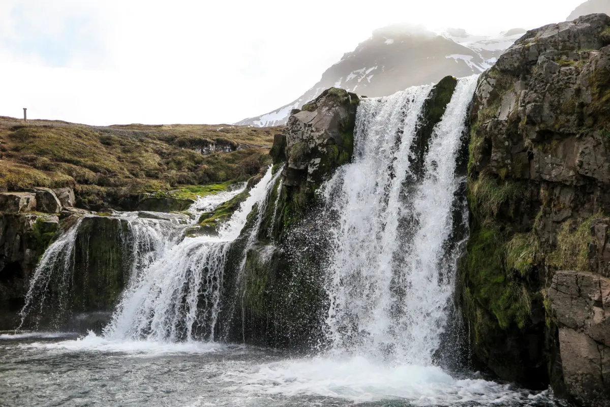 Kirkjufellsfoss waterfall, lying just next to Kirkjufell Mountain.