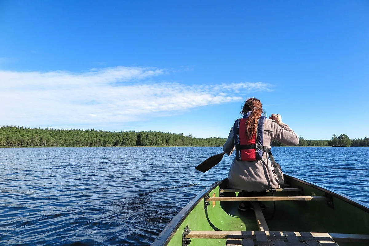 Paddling on the calm lake by Kolarbyn Huts www.travelgeekery.com