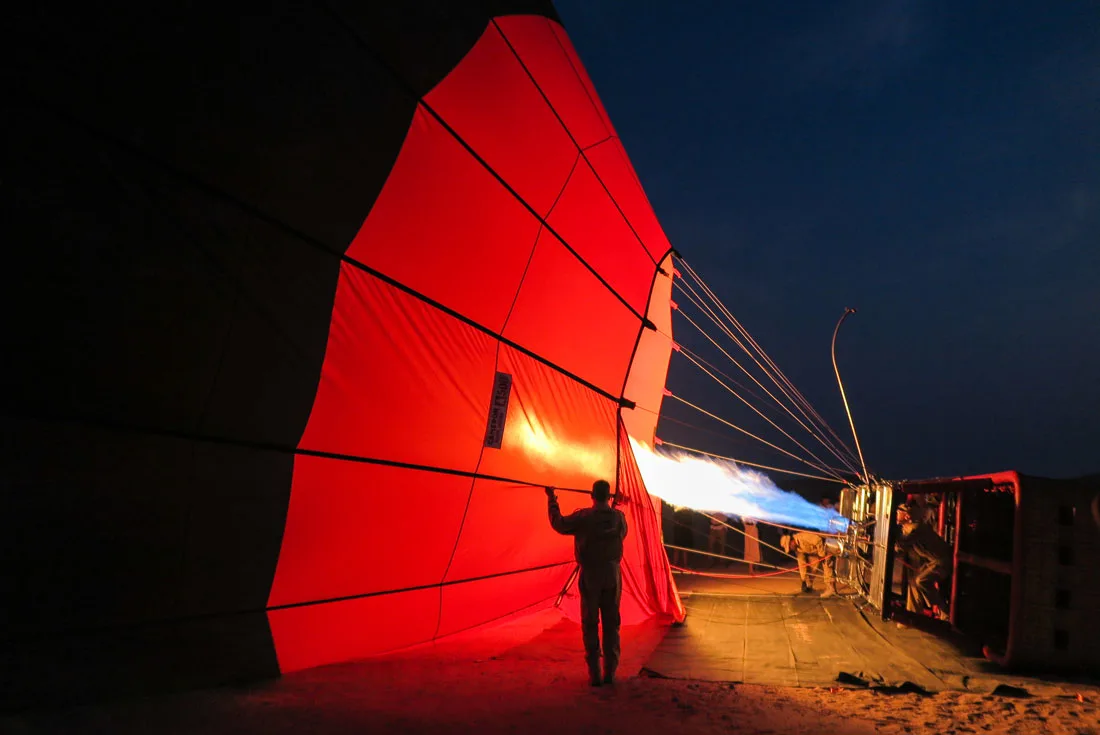 Getting ready for our balloon's takeoff in Dubai desert upon sunrise