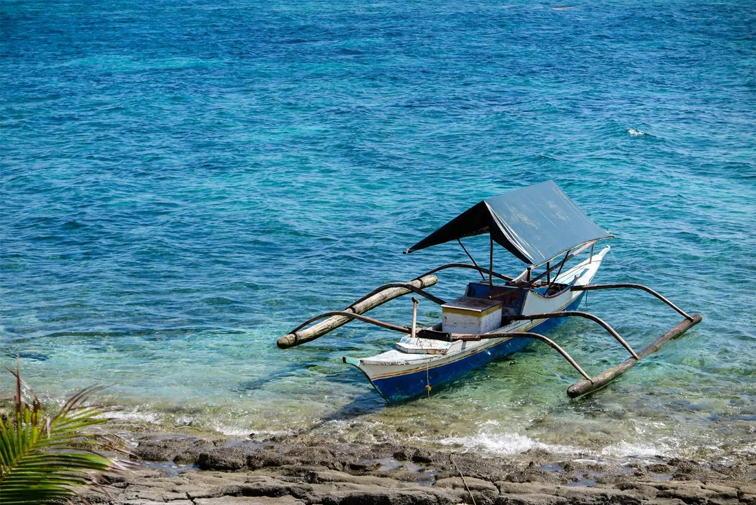 Firshermen's pump boat anchored by the shores of Kalanggaman Island