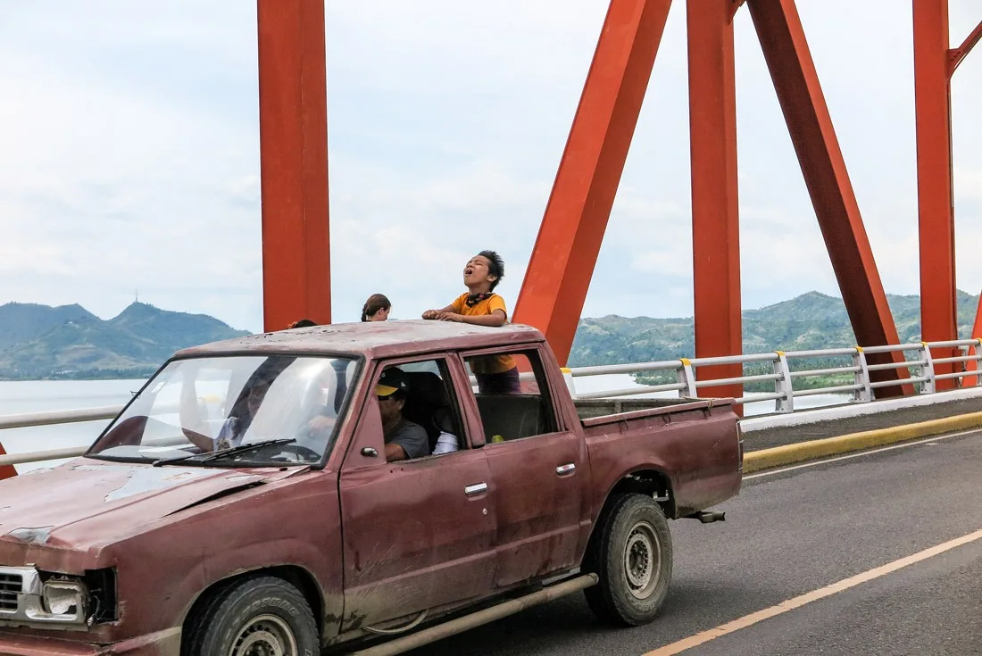 A Filipino kid enjoying the ride on the San Juanico bridge