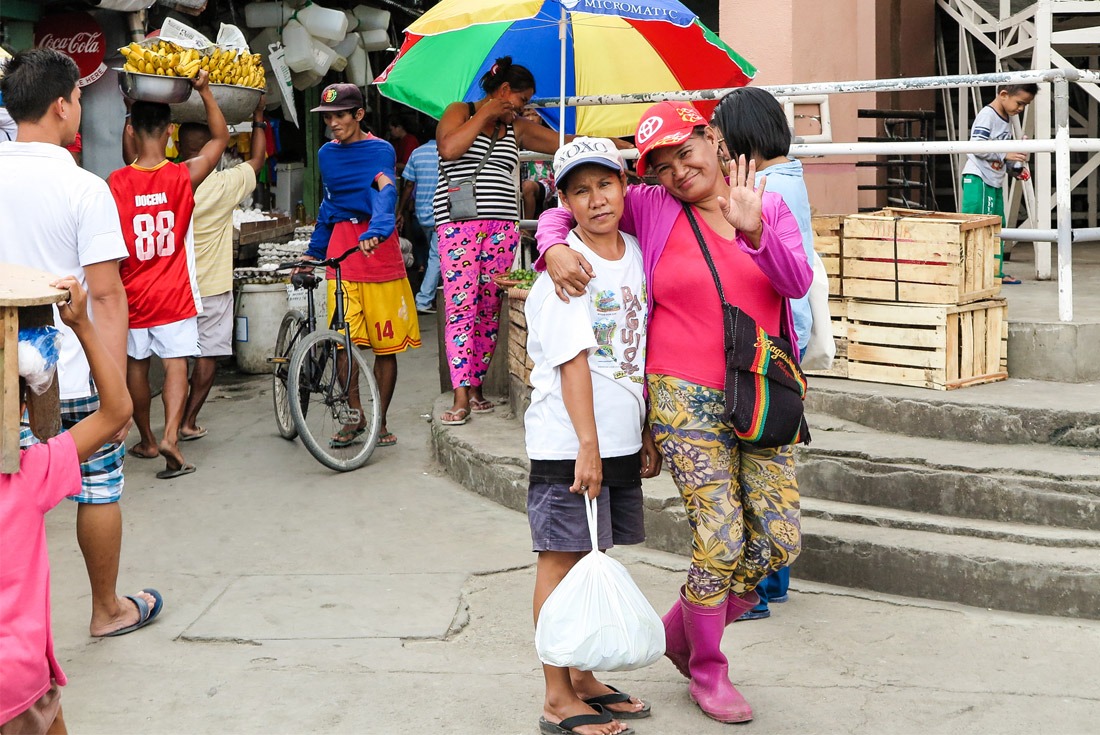 Ladies posing at the Tacloban street market