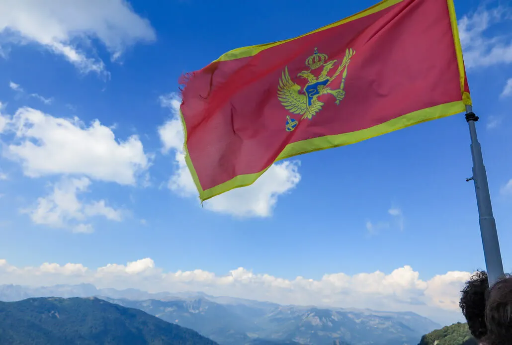 Montenegro flag on top of Bendovac viewpoint, Bjelasica Mountains, Montenegro