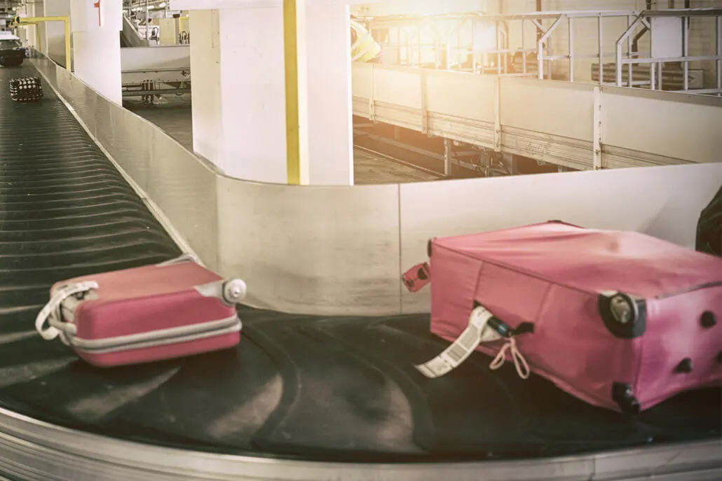 Colorful luggage on airport carousel
