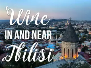 View of Tbilisi Georgia with text overlay Wine in and near Tbilisi