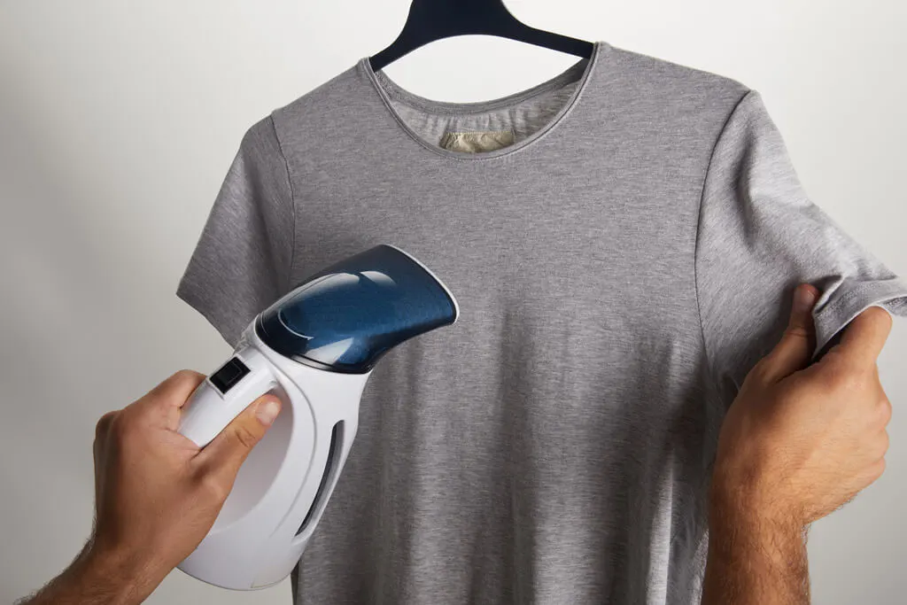 Using a travel steamer on a T-shirt