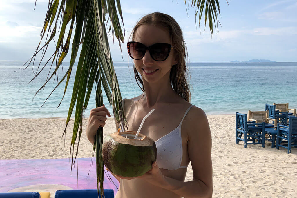 Veronika of TravelGeekery on a beach