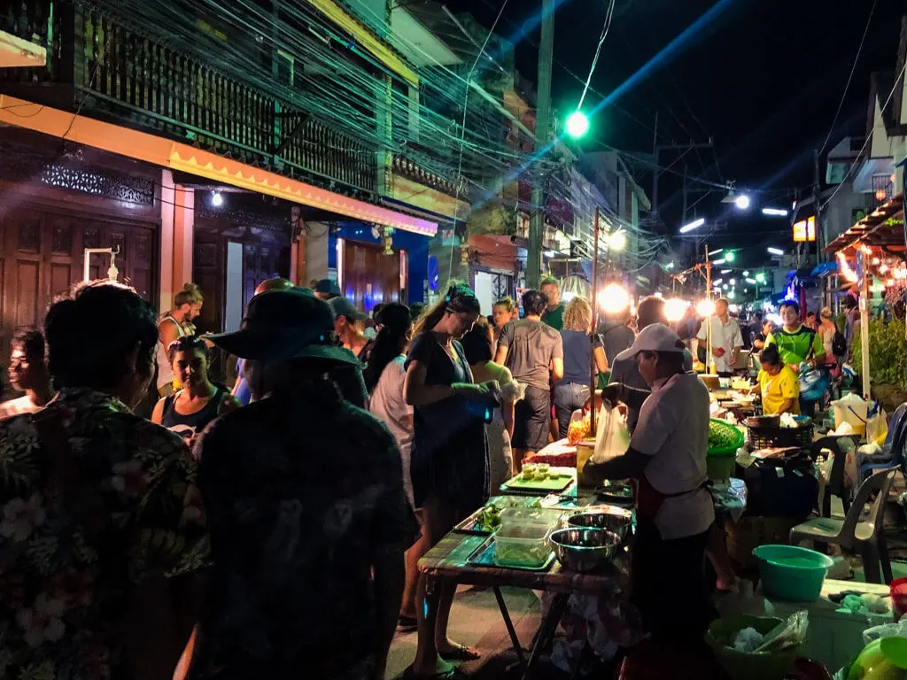 People at a market in Thailand