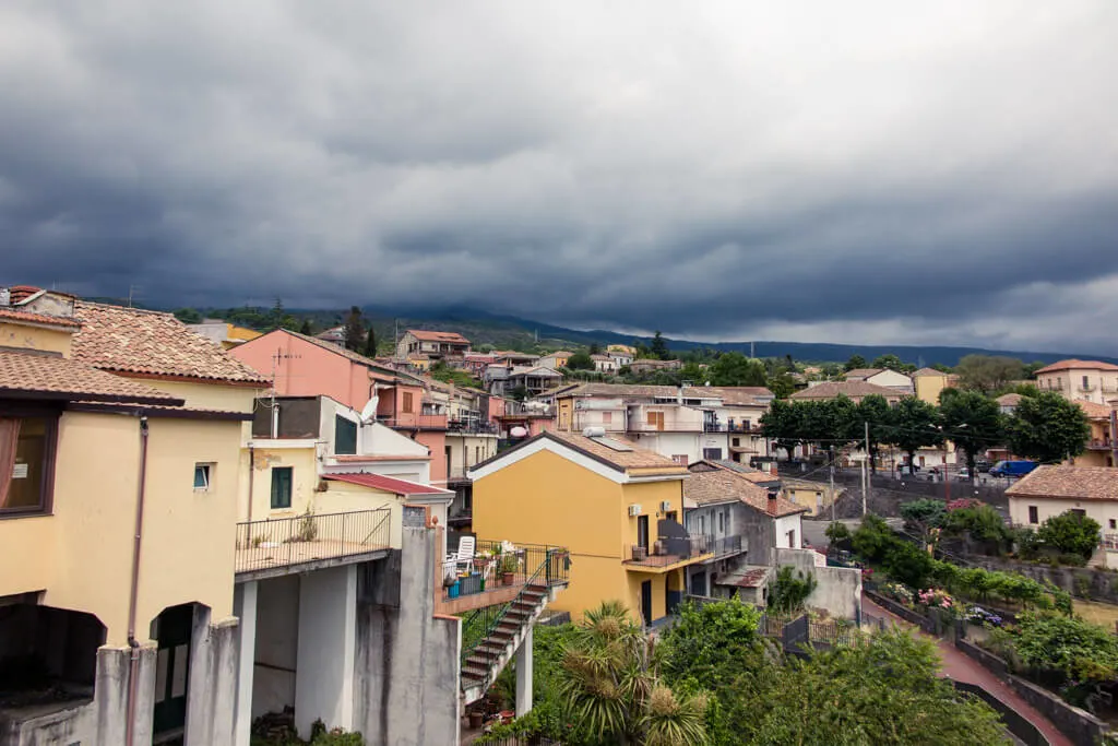 Milo town with Mount Etna in the distance