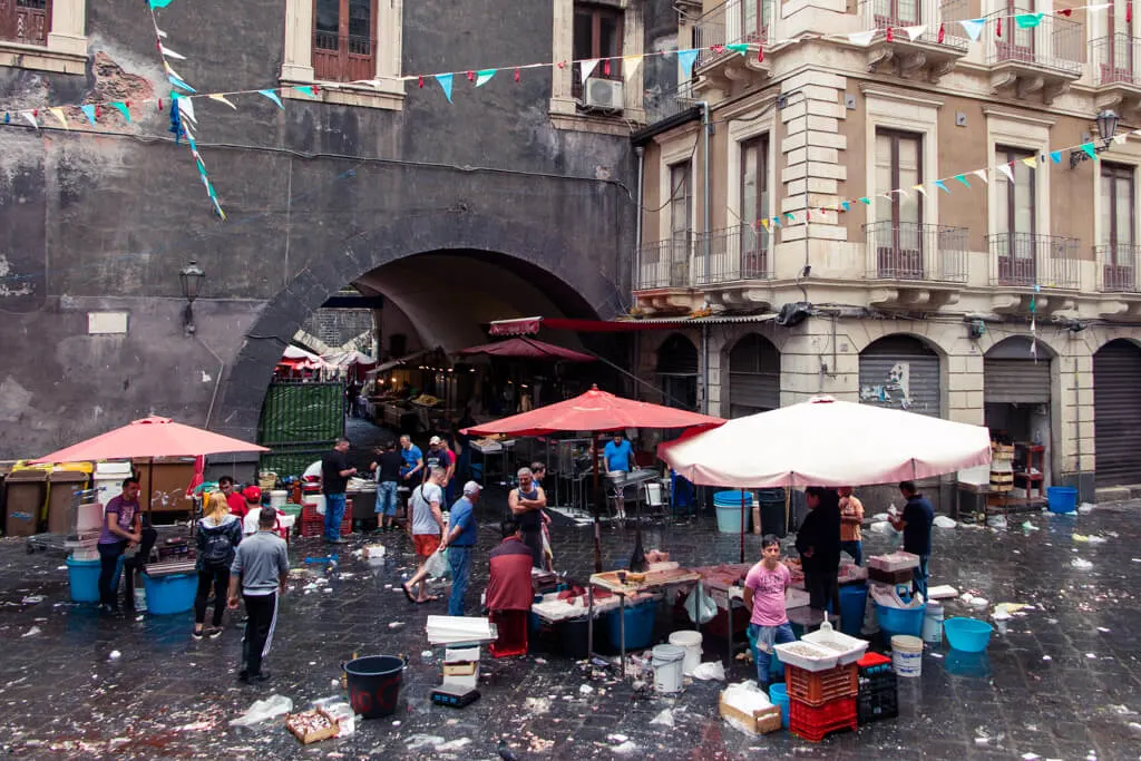 View of Catania Fish market with stalls and dirty tiles