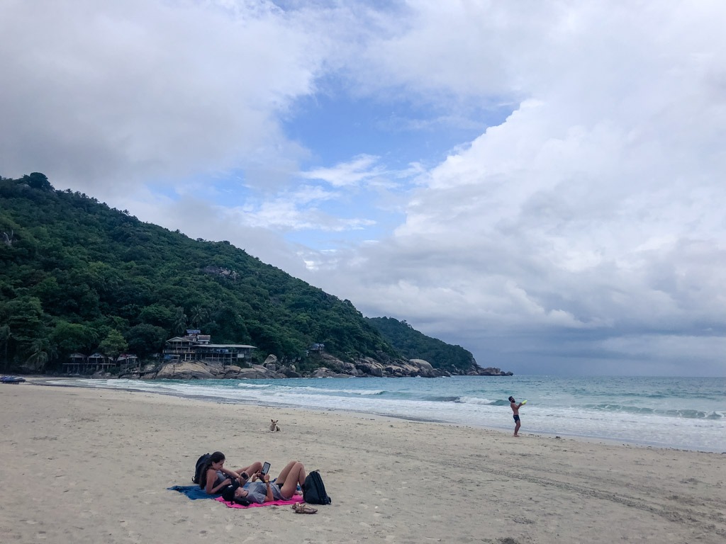 People on a beach in Thailand on a windy day