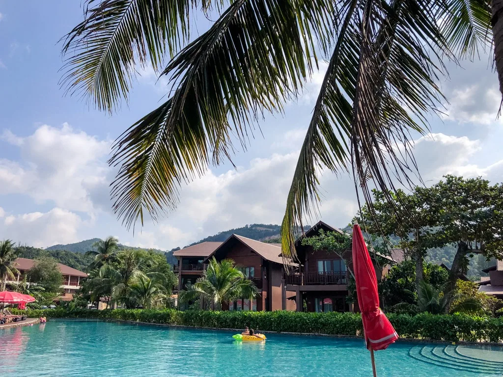 A resort swimming pool with poolside villas in Koh Phangan Thailand