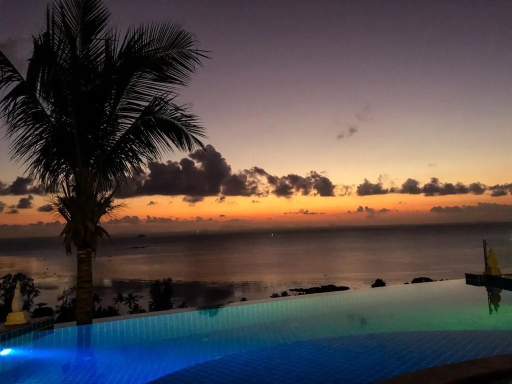 View of a sunset in Koh Phangan Thailand from an infinity pool