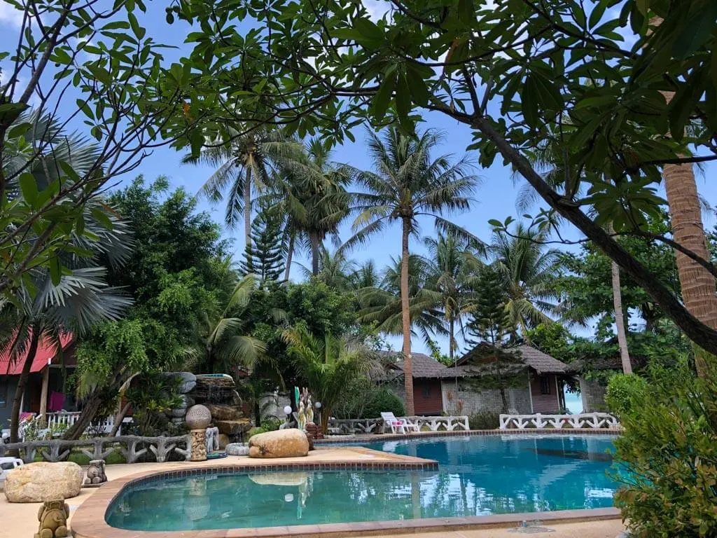 an outdoor swimming pool in a resort