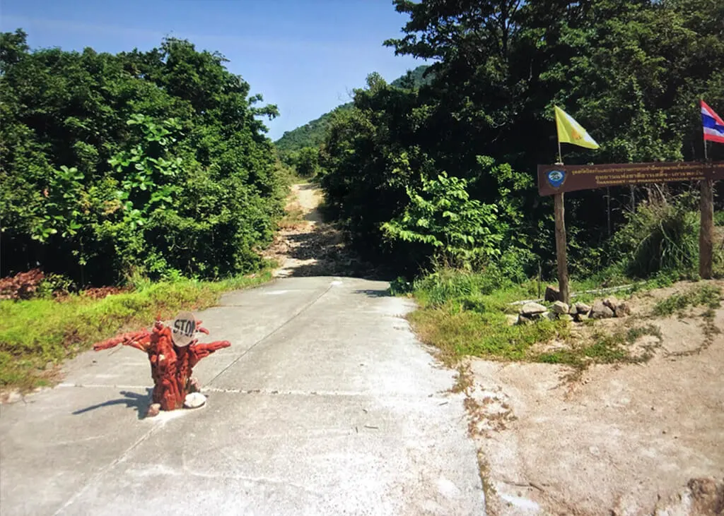 End of paved road on a tropical island, then just wilderness