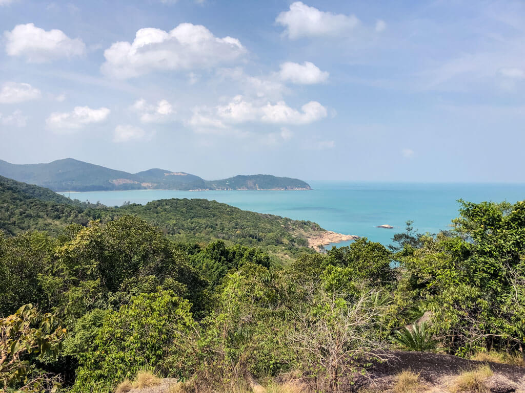 On a tropical island - views of green hills and the ocean