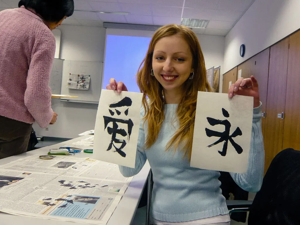 Drawing Chinese characters in a calligraphy class