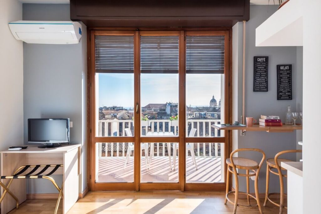 A studio apartment in Catania with a large terrace