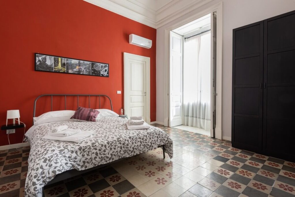 A room in a Catania apartment with original floors
