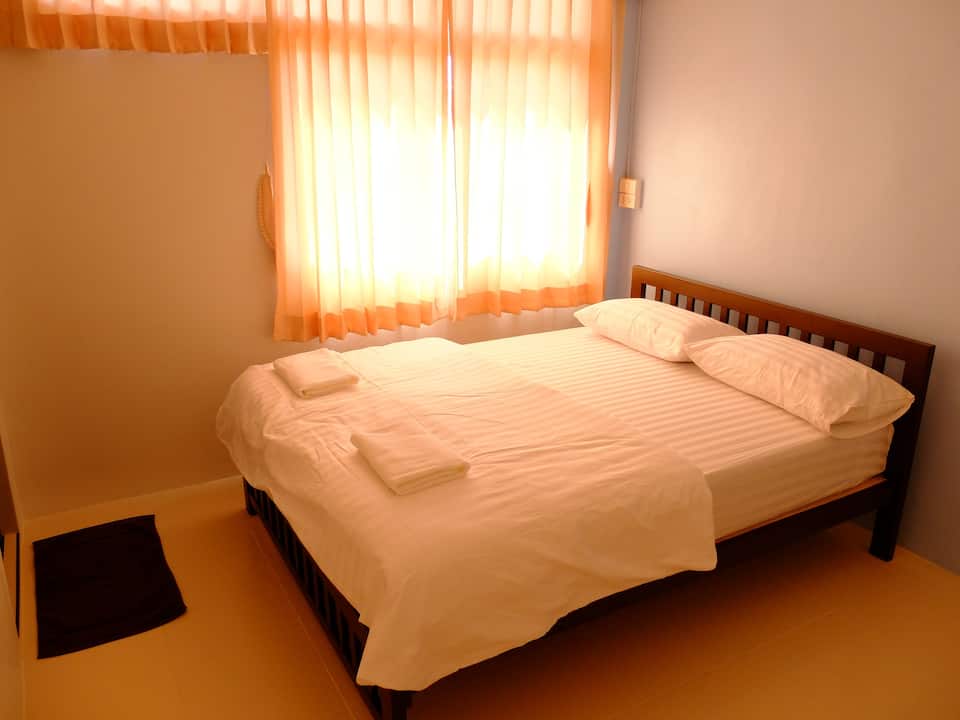 Bed by a window