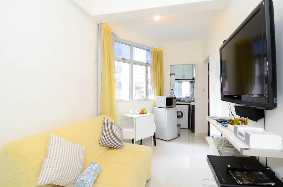 Small studio with yellow decor