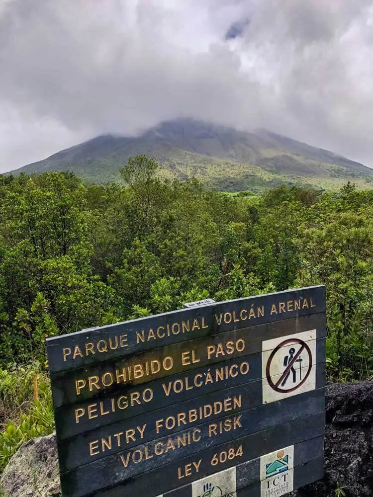 view of a volcano covered in clouds