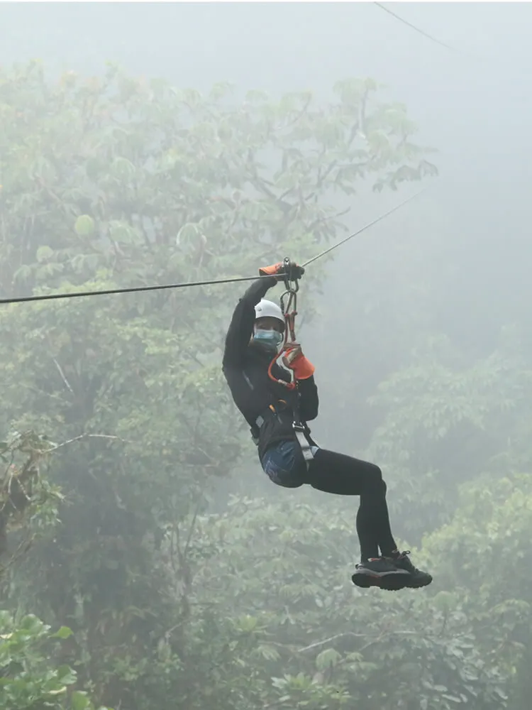Canopy tour (zipline) in a foggy cloud forest in Costa Rica
