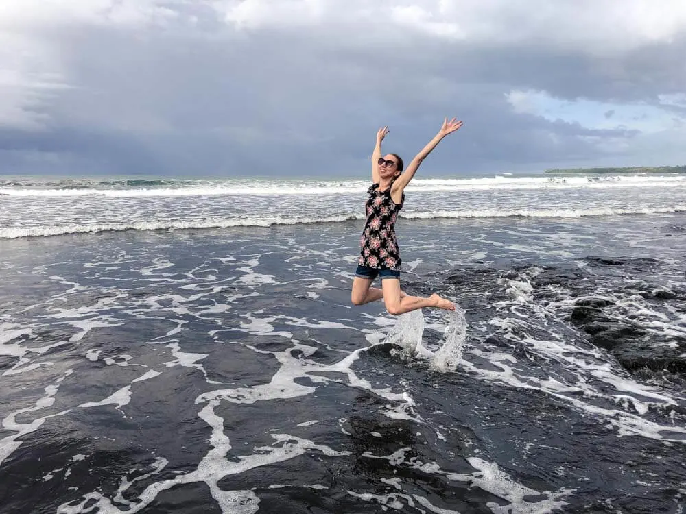 Veronika jumping on a beach in Costa Rica