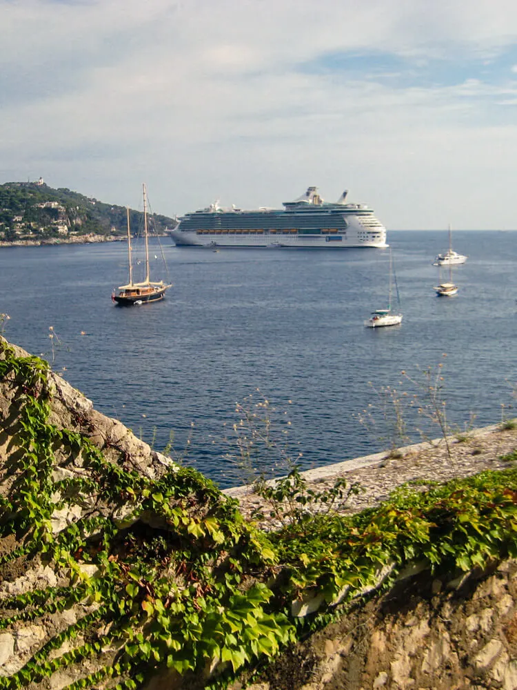 A large cruiseship anchored near the coast