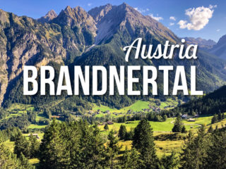 View of a Mountain Valley with a text overlay: Brandnertal Austria