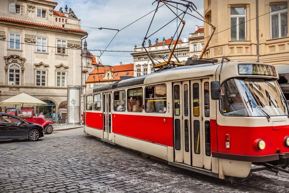 A red tram in the streets of Prague