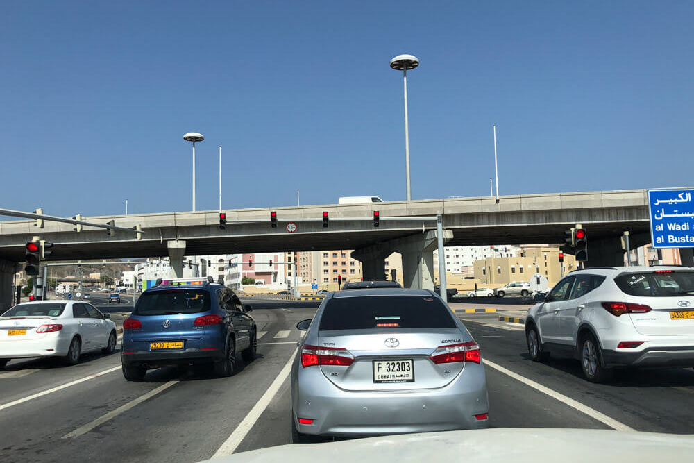 Cars stopped at a traffic light in Muscat Oman