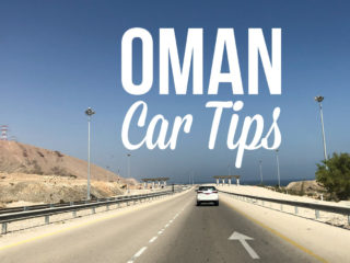 View of a car driving in Oman with a text overlay: Oman Car Tips