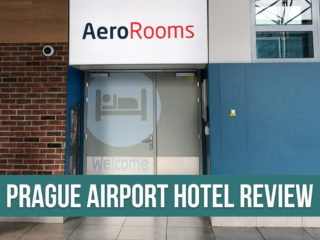 View of an airport hotel entrance with the sign Aerorooms and a text overlay: Prague Airport Hotel Review