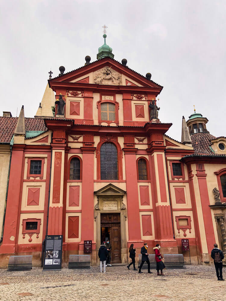Colorful facade of the St. George's Basilica in Prague Castle
