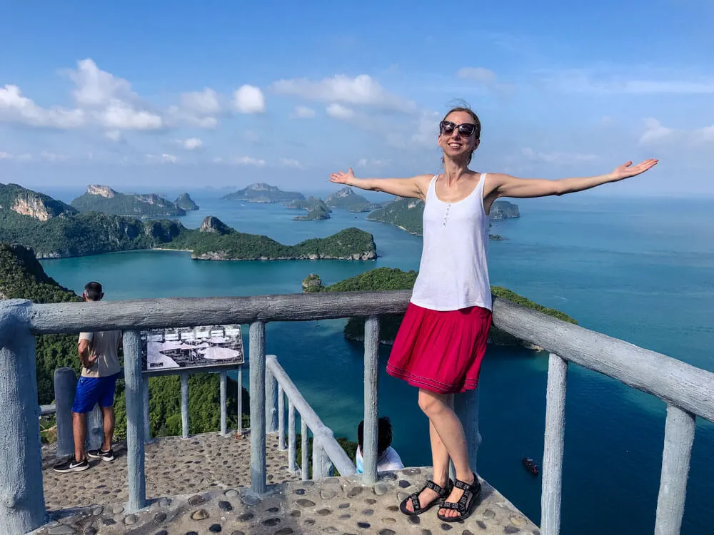 Veronika on top of a hill with a view of islands in Thailand