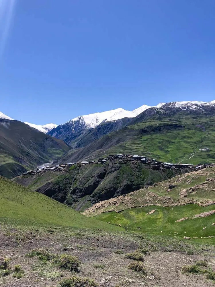 View of Xinaliq village with Caucasus mountains