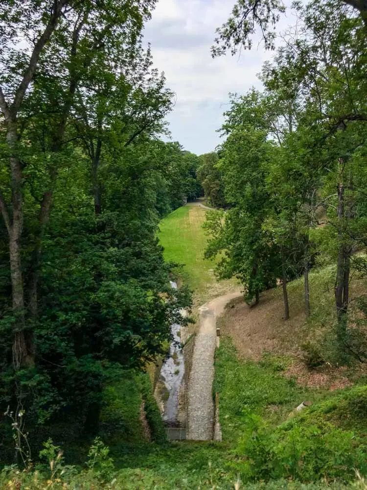 View of Prague Castle's Stag Moat full of greenery