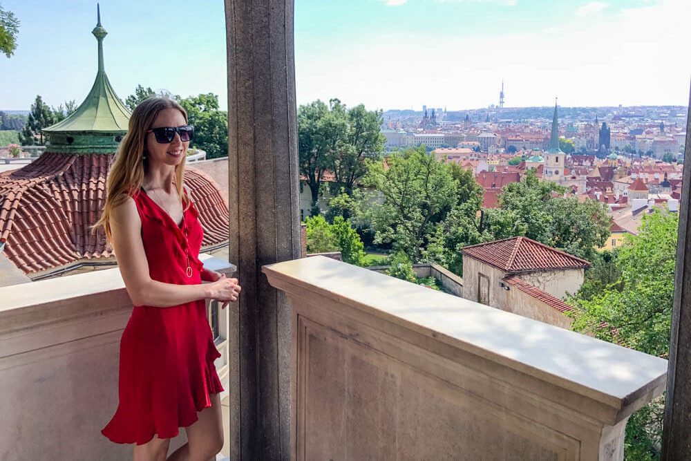 Veronika posing with a view of Prague