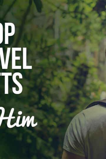 A man in greenery with a text overlay: Top Travel Gifts for Him