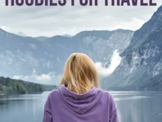 A woman sitting by a lake with her back towards us with a text overlay: Women's Hoodies for Travel