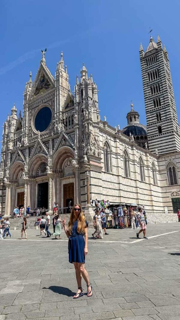 Veronika posing in front of the Duomo in Siena