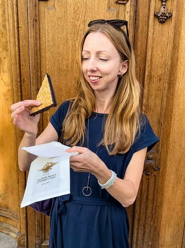 Veronika trying a sweet pastry from the oldest bakery in Graz