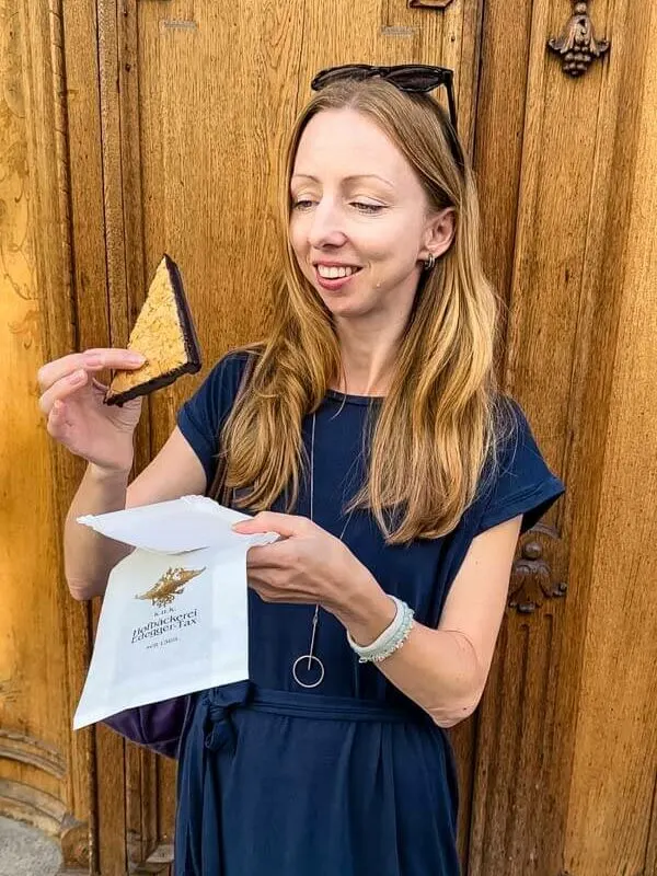 Veronika trying a sweet pastry from the oldest bakery in Graz