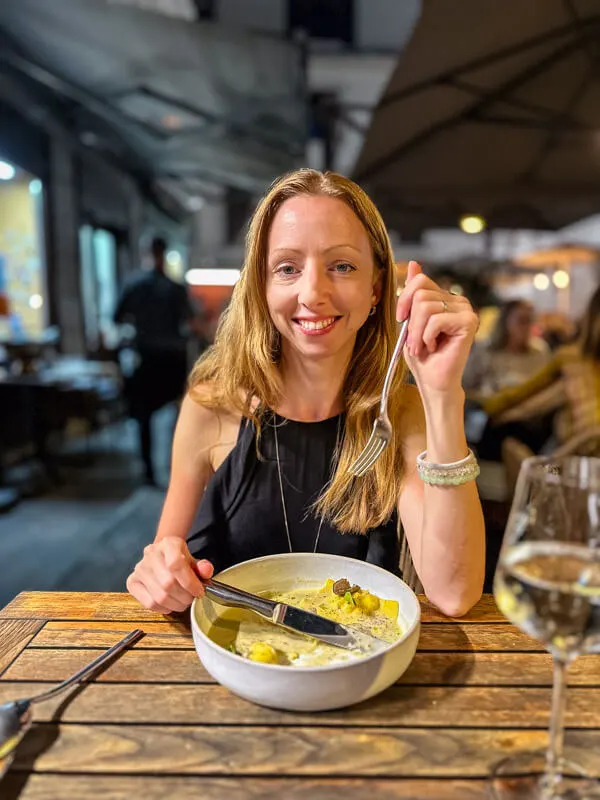 Veronika enjoying truffle pasta at Dreizehn Restaurant Graz